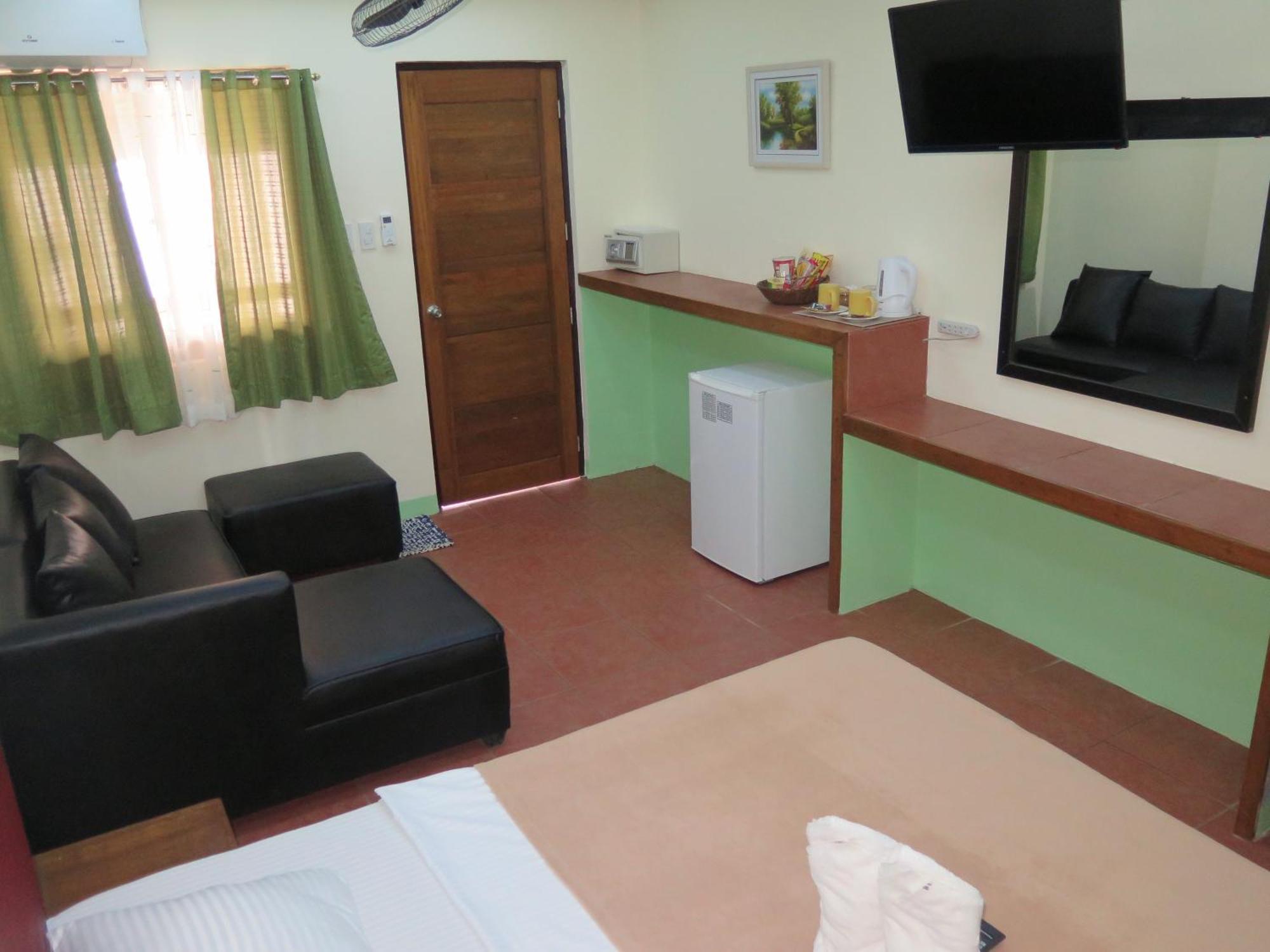פוארטו גאלרה Badladz Beach And Dive Resort חדר תמונה